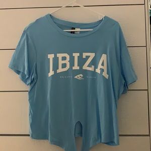 blue t-shirt with writing on front